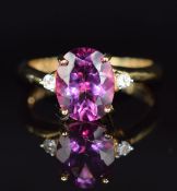 A 14k gold ring set with cherry and white topaz, 3.9g, size N