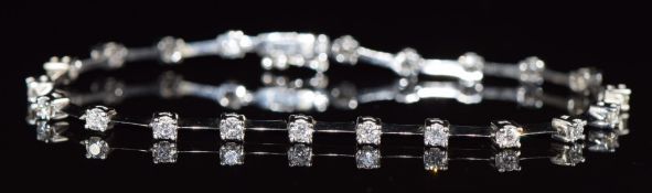 An 18ct white gold bracelet set with twenty one diamonds, each approximately 0.08ct, length 19cm,