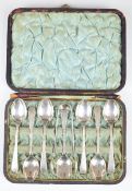 Cased set of Victorian hallmarked silver spoons, tongs and scoop, Sheffield 1885, maker A