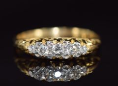 A c1920 18ct gold ring set with five diamonds, 3.4g, size O/P