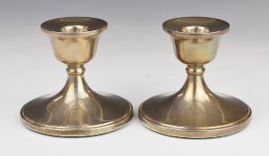 Pair of Elizabeth II hallmarked silver candlesticks, Birmingham 1971, maker Barker Ellis Silver