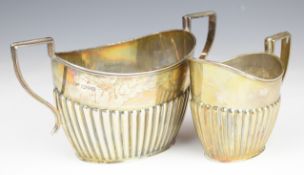 Edward VII hallmarked silver sugar bowl and milk jug both with reeded lower body, Chester 1908,