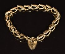 A 9ct gold bracelet with feather or similar decoration, length 19cm, 9.4g