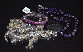 An amethyst and silver necklace, citrine and labradorite necklace and silver bracelet set with