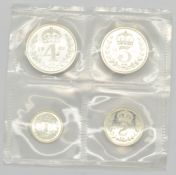 1989 Queen Elizabeth II Maundy set, first bust, in white leather pouch