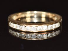 A 9ct gold half eternity ring set with eleven diamonds totalling approximately 0.25ct, 2.3g, size M