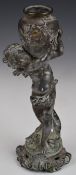 Spelter model of a cherub holding a vase aloft, height 24cm