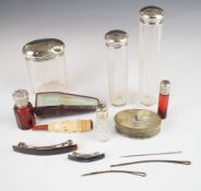 Four hallmarked silver lidded cut glass dressing table bottles, two further red glass bottles,