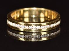 An 18ct gold half eternity ring set with diamonds, 3.4g, size K