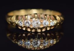 An 18ct gold ring set with five old cut diamonds, Birmingham 1912, 2.7g, size K