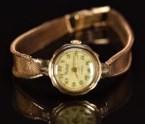 Rone 9ct gold ladies wristwatch with gold hands and Arabic numerals, silver dial and signed 17 jewel