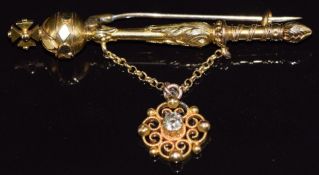 A 14k gold brooch in the form of a orb scepter with a filigree drop section set with an old cut