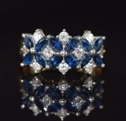An 18ct gold ring set with diamonds and sapphires, bespoke made in Gibraltar by Don Lal in 2005,
