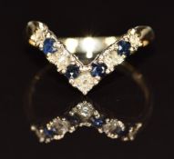 A 9ct gold V shaped ring set with sapphires and diamonds, 2.3g, size R