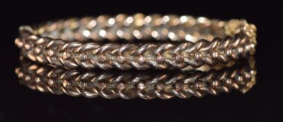 Victorian 9ct rose gold bangle with plaited and sphere decoration, 12.9g