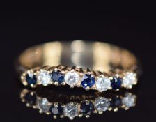A 9ct gold ring set with sapphires and diamonds, 1.6g, size O