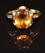 A 9ct gold ring set with an oval cut citrine, 2.2g, size O