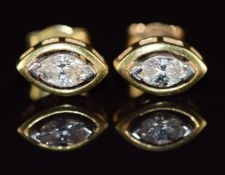 A pair of 18ct gold earrings, each set with a marquise cut diamond of approximately 0.3ct, 3g