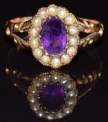 Edwardian 9ct gold ring set with an oval cut amethyst surrounded by seed pearls, Birmingham 1908,