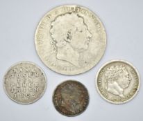 Four George III coins comprising 1819 crown, 1816 bull head shilling, 1805 Irish ten pence bank