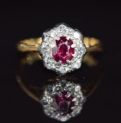 A c1920 18ct gold ring set with a ruby and diamonds, 1.6g, size F