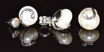 A 14k white gold pendant set with a pearl and cubic zirconia, with matching earrings, 7.7g