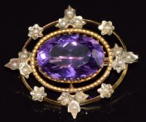 Edwardian 9ct gold brooch set with an oval cut amethyst and seed pearls, 6.0g, 3.1 x 2.8cm