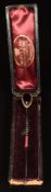Victorian 9ct gold stick pin set with a pear shaped foiled garnet cabochon (3.7g), in antique box '