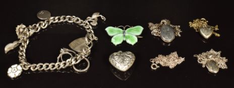 Four silver pendants, three silver chains, silver charm bracelet and a silver butterfly brooch set