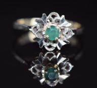 An 18k white gold ring set with an emerald, 3.9g, size N