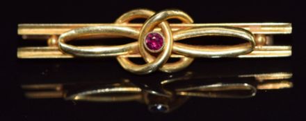 A c1915 15ct gold brooch set with a ruby, 4.1g, 4.5cm
