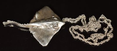 A hallmarked silver pendant in the form of a stingray, on silver chain, maker C G & S, 43g
