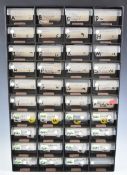 A collection of world coinage in a plastic collector's 40 drawer cabinet, includes Euros
