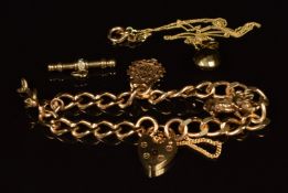 A 9ct gold charm bracelet with three 9ct gold charms including pig, 'good luck' and dolphin, 9ct