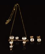 A 9ct gold pendant set with topaz, with matching earrings, 5.3g