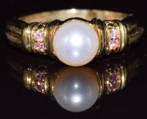 A 9k gold ring set with a pearl and pink sapphires, 4g, size N