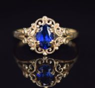 A 14k gold ring set with a synthetic sapphire, 1.7g, size M