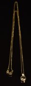 An 18k gold pendant set with a diamond on 18k gold chain, 2g