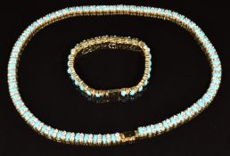 A 14k gold necklace and matching bracelet set with faux turquoise and cubic zirconia, lengths 44 and