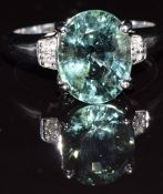 An 18ct white gold ring set with paraiba tourmaline and diamonds, 6.0g, size M/N