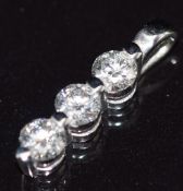 An 18ct white gold pendant set with three diamonds, each approximately 0.15ct, 1.1g