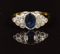 Art Deco 18ct gold ring set with an oval cut sapphire of approximately 0.7ct and diamonds in a