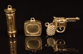 Three 9ct gold charms in the form of a postbox, gun and television, 3g