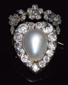A mid to late Victorian brooch in the form of a heart set with a large natural pearl measuring 11.