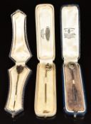 Three 9ct gold Victorian stick pins, one in the form of a shield, one a knot and the other a half