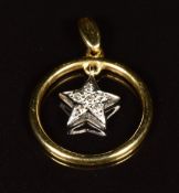 An 18ct gold circular pendant set with diamonds in a star setting, 2.7g