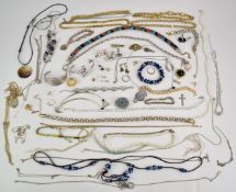 A collection of costume jewellery including a single strand pearl necklace with 14K clasp, section