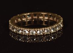 A 9ct gold eternity ring set with spinel in antique box, 1.9g,