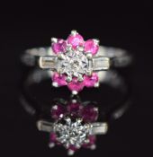 An 18ct white gold ring set with round cut rubies and baguette and round cut diamonds, 4.3g, size N