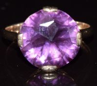 A 9ct gold ring set with a synthetic purple sapphire, 4.7g , size T